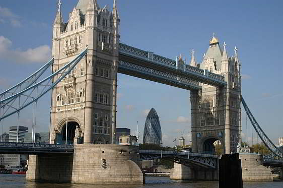 View of London's famous Tower Bridge framing the 40 storey Gherkin Tower