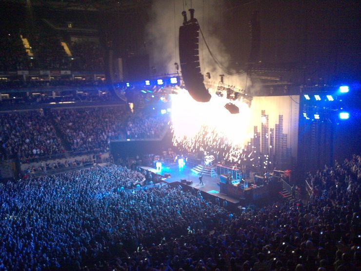 Fans enjoying a live concert inside London's O2 Arena 