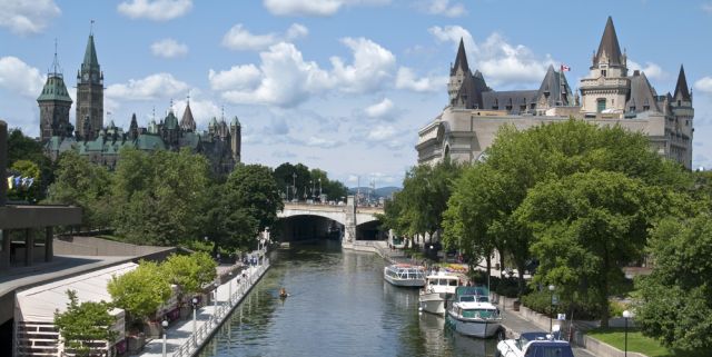 Boats in the Rideau Canal and the famous Chateau Laurier Hotel on the right
