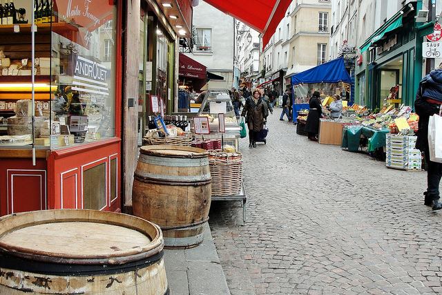 Colourful shops and stalls lining Rue Mouffetard Market