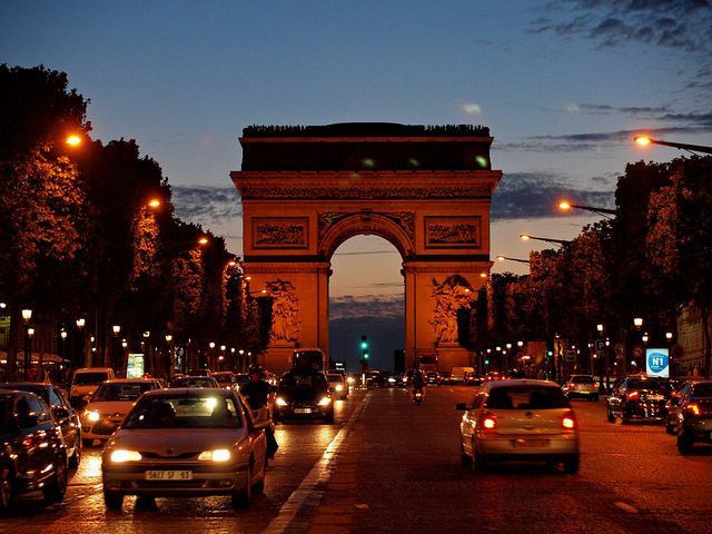 Dramatic view of the Arc de Triomphe at dusk
