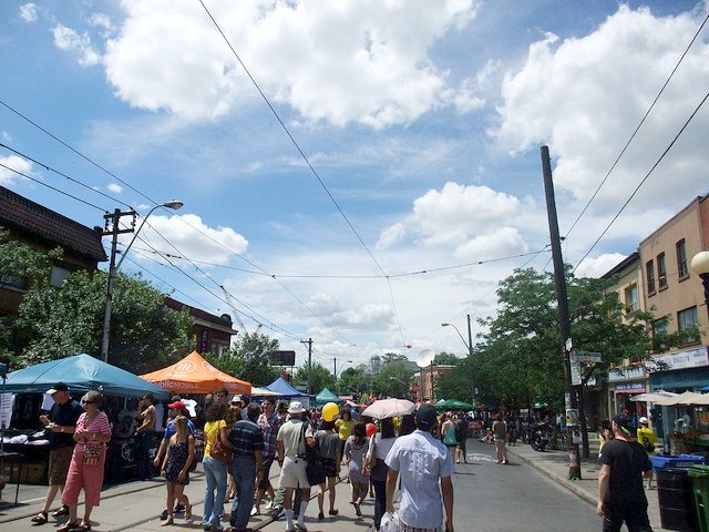 People enjoying Little Italy along College Street West during the Taste of Little Italy event