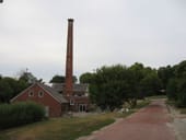 Another view of the old paper mill showing the red brick path