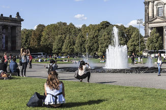 People enjoying a nice day in Lustgarten Berlin