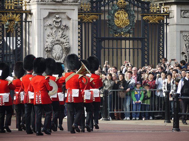 Visitors enjoy an upclose view of the Changing of the Guards in front of the gates of Buckingham Palace