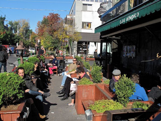 Soaking up the sunshine in front of a cafe in Mile End