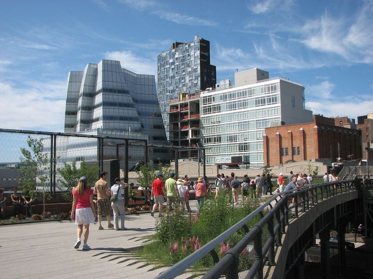 People enjoying a stroll through High Line Park in New York City