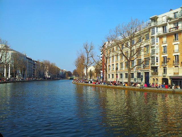 People enjoying a sunny day along the banks of Canal Saint-Martin