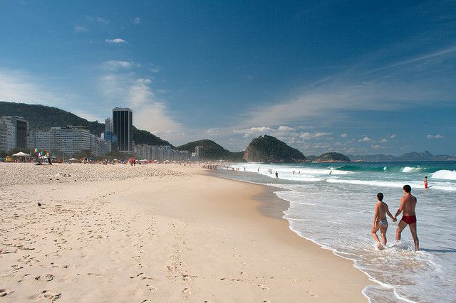 Enjoying the white sand and sure along Copacabana Beach