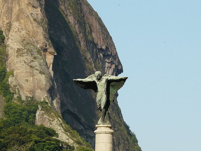 Sugarloaf Mount provides a dramatic backdrop to the angel on top of the monument in Praca General Tiburcio