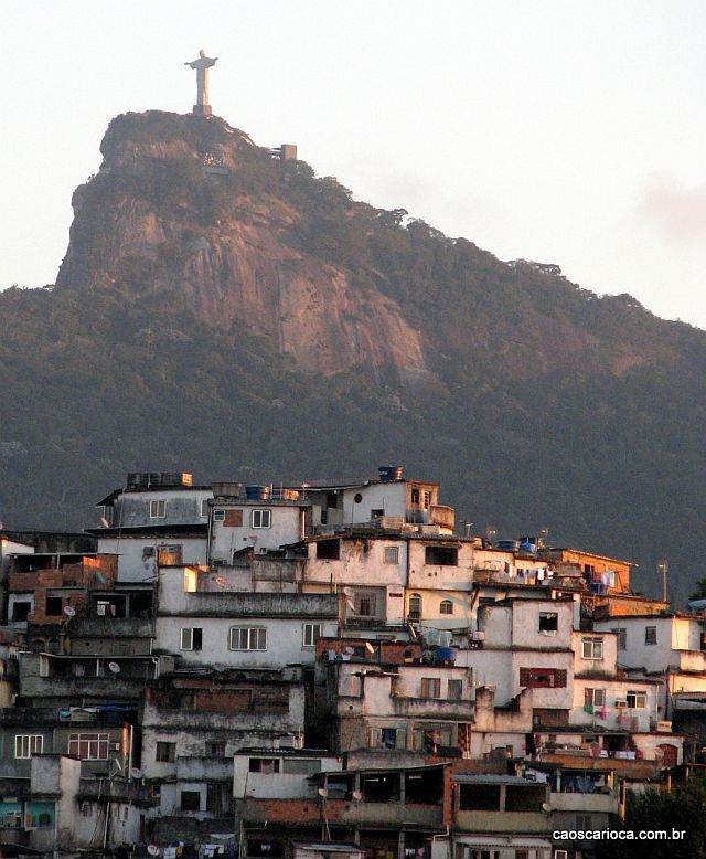 Statue of Christ the Redeemer appears to watch over a Favela