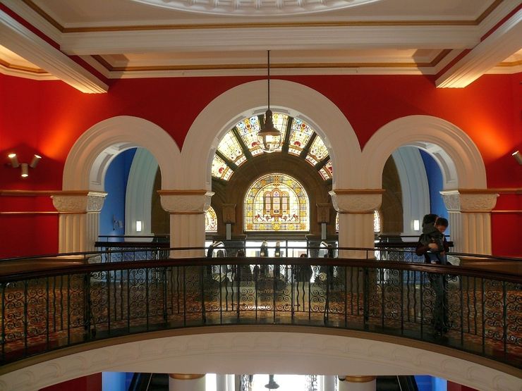 Beautiful arches and stained glass windows inside the Queen Victoria Building