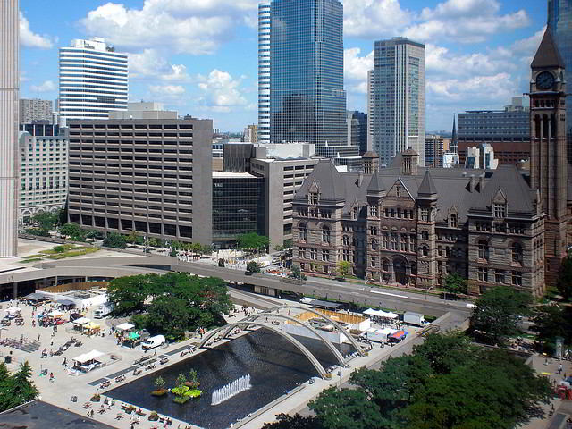 A view of Nathan Phillips Square with Toronto's Old City Hall in the background