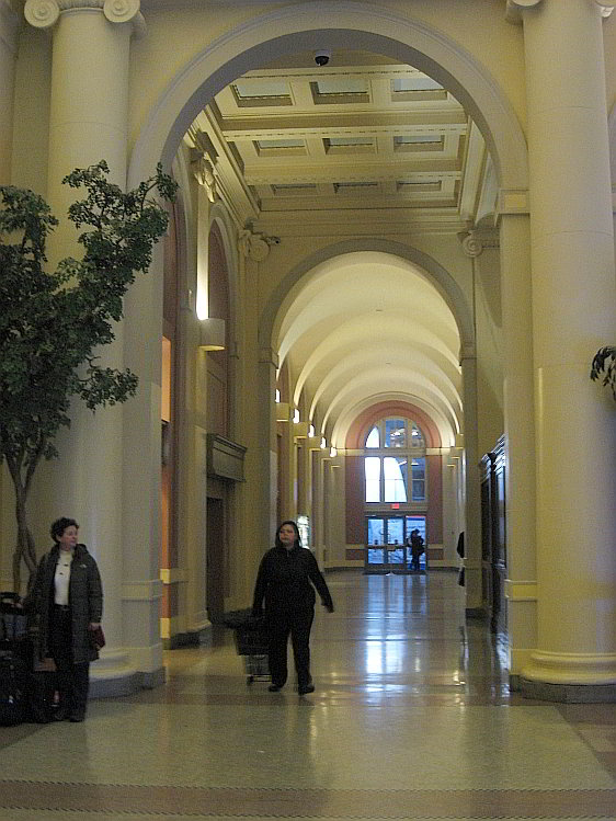 Symmetric Arches and Columns Leading into the Main Hall of Waterfront Station